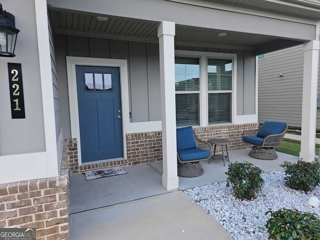 doorway to property featuring a porch