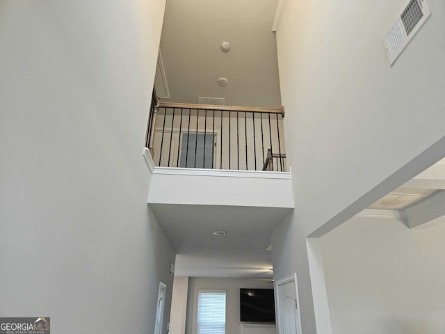 staircase with a high ceiling