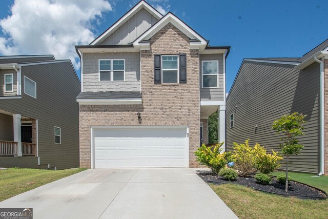 view of front of house with a garage and a front lawn