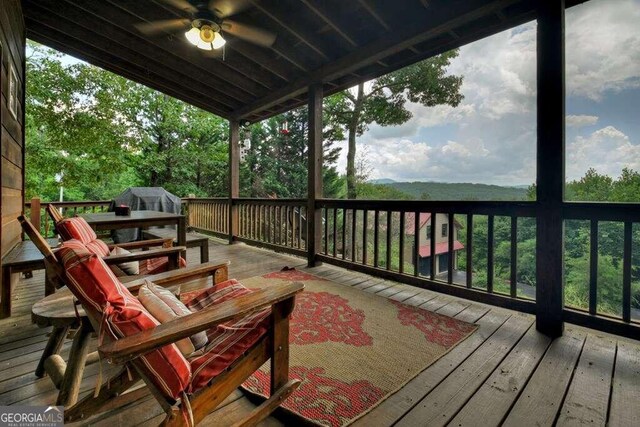 wooden terrace with ceiling fan