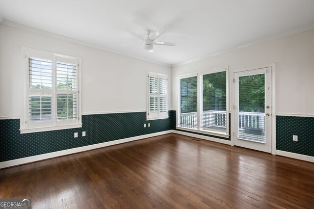 spare room featuring wood-type flooring, crown molding, and ceiling fan