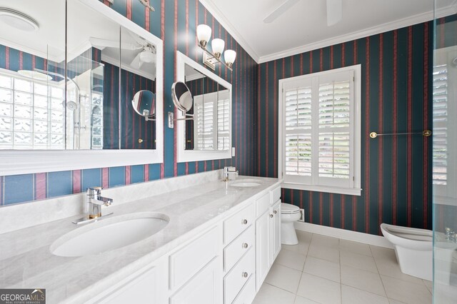 bathroom with tile patterned flooring, crown molding, a bidet, dual bowl vanity, and toilet