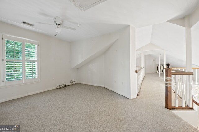 additional living space featuring light carpet and ceiling fan