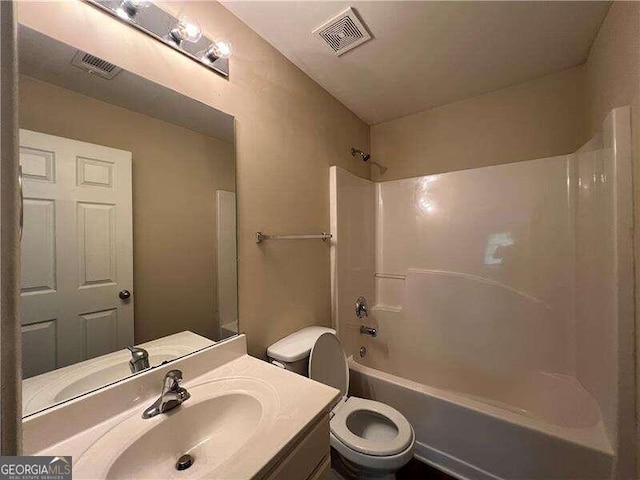 full bathroom featuring vanity,  shower combination, and toilet