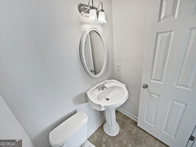 608 Summer Pl, Norcross, GA 30071 - half bathroom with baseboards and toilet