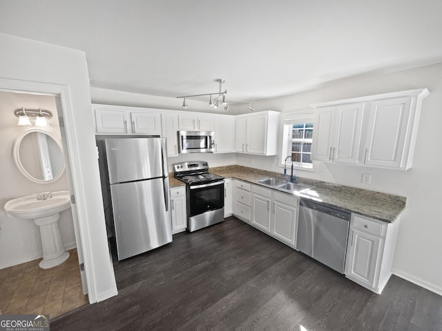 608 Summer Pl, Norcross, GA 30071 - kitchen with a sink, white cabinetry, stone counters, appliances with stainless steel finishes, and dark wood-style floors