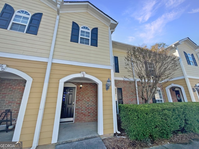 608 Summer Pl, Norcross, GA 30071 - doorway to property featuring brick siding