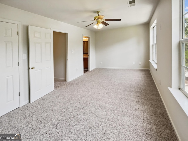 unfurnished room with carpet floors and ceiling fan