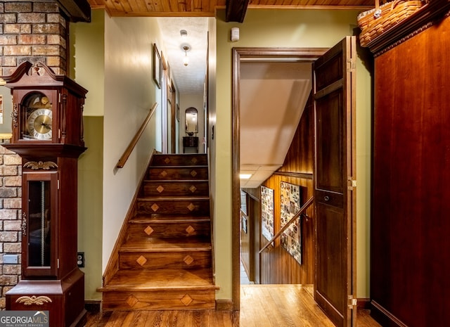 staircase with wood-type flooring