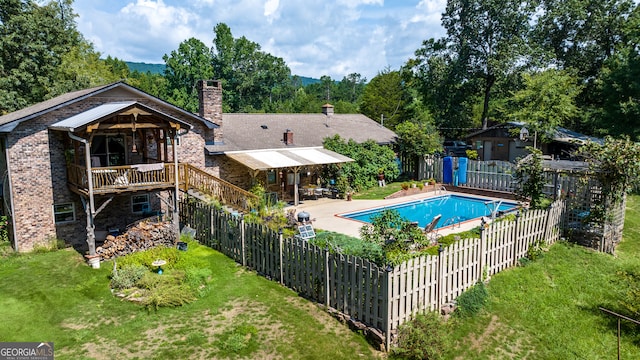 view of pool with a yard and a patio area