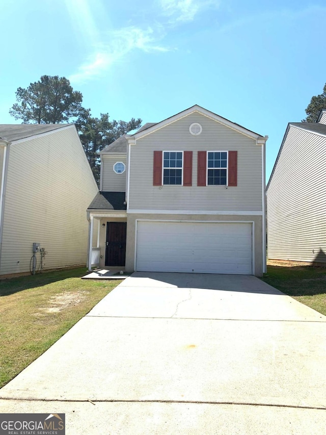 front facade with a garage and a front yard