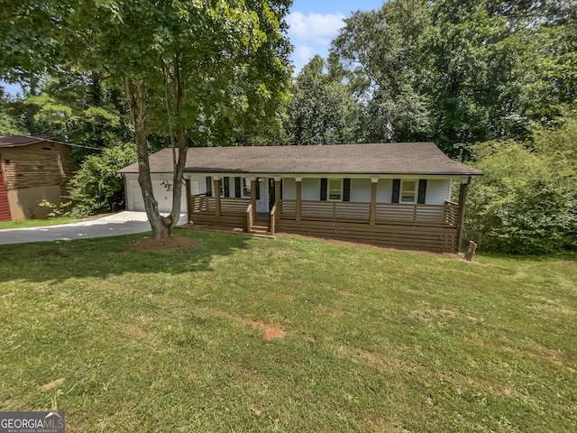 view of front of property with a porch, a garage, and a front yard