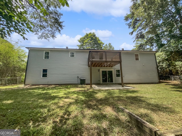 back of house with central AC unit, a pergola, a lawn, and a patio area