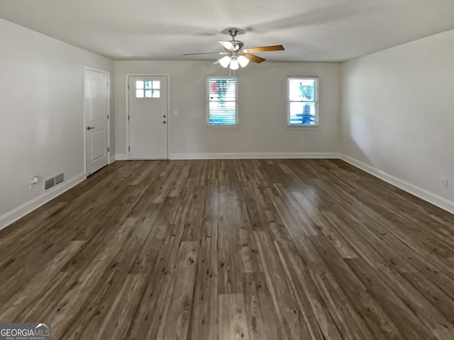 interior space with dark hardwood / wood-style floors and a wealth of natural light