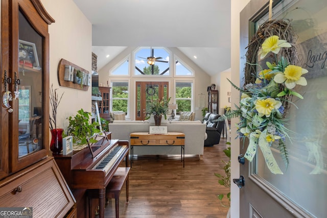 dining room featuring high vaulted ceiling, dark hardwood / wood-style floors, and ceiling fan