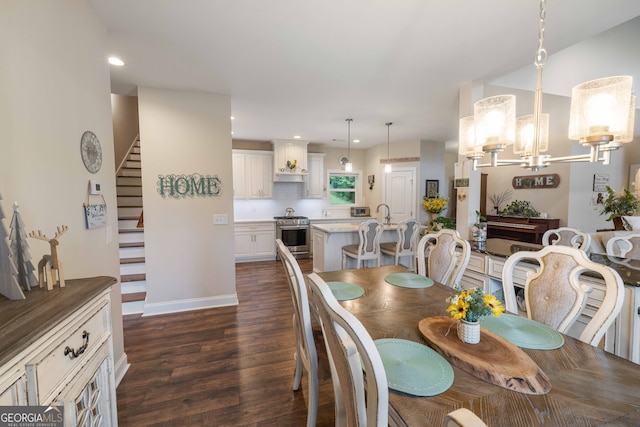 dining space featuring a notable chandelier and dark hardwood / wood-style floors