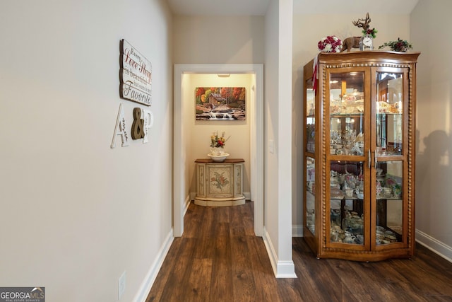 hall with dark hardwood / wood-style floors