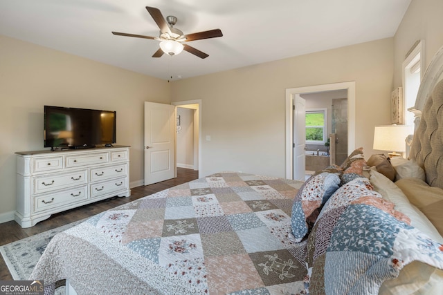 bedroom with dark wood-type flooring, ceiling fan, and connected bathroom