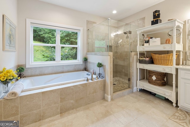 bathroom featuring tile patterned floors, vanity, and separate shower and tub