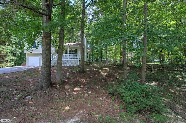 view of front facade featuring a garage and a porch