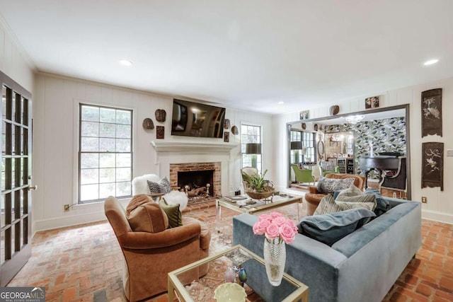 living room featuring a fireplace and ornamental molding