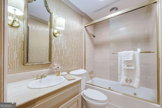 full bathroom with vanity, crown molding, bath / shower combo with glass door, and toilet