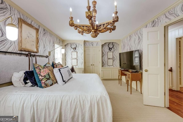 bedroom with ornamental molding and an inviting chandelier