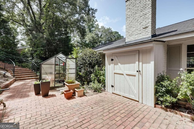 view of patio with an outdoor structure