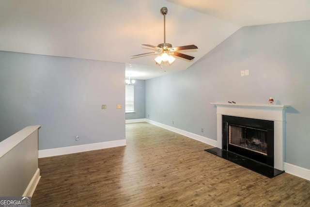 unfurnished living room with hardwood / wood-style flooring, vaulted ceiling, and ceiling fan