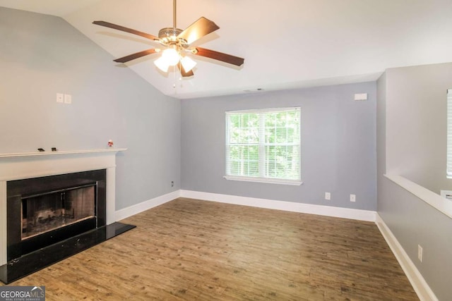 unfurnished living room featuring ceiling fan, hardwood / wood-style flooring, and lofted ceiling