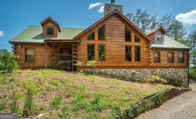 view of log cabin