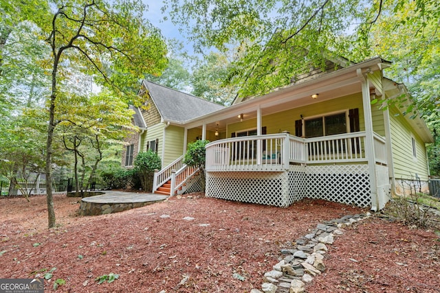 rear view of property featuring cooling unit