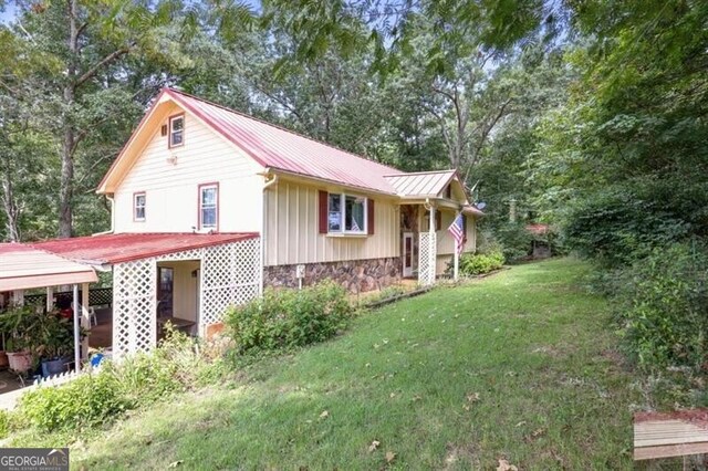 view of property exterior featuring a lawn