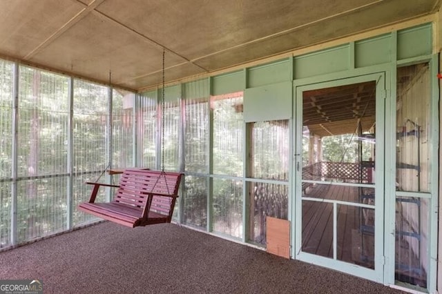 unfurnished sunroom featuring a healthy amount of sunlight