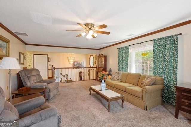 carpeted living room featuring crown molding and ceiling fan