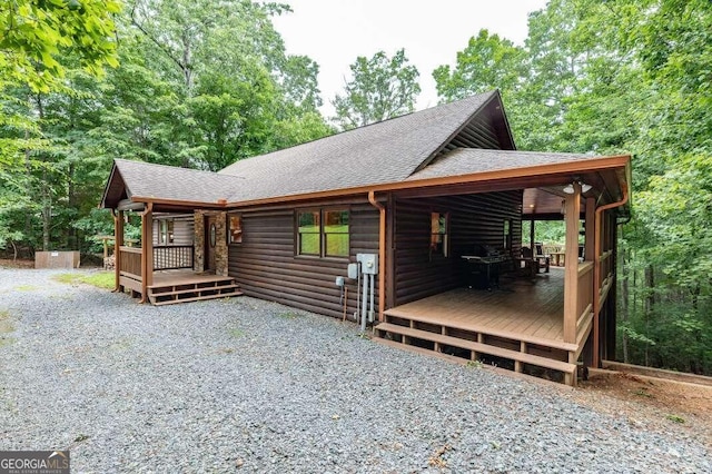 view of property exterior featuring a deck