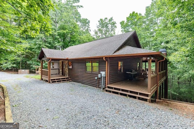 view of side of home featuring a deck