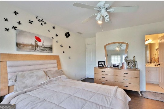 bedroom with ensuite bath, wood-type flooring, and ceiling fan