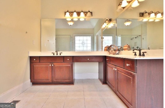 bathroom with tile patterned floors and vanity