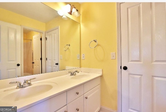 bathroom with dual vanity