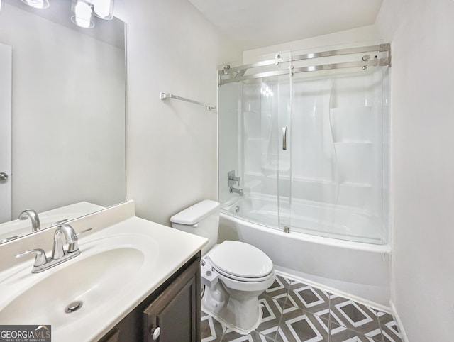 full bathroom with toilet, vanity, and shower / bath combination with glass door