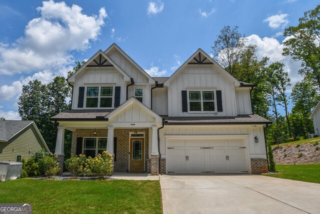 craftsman-style home with a garage and a front yard