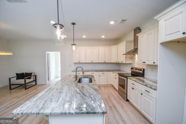 kitchen featuring white cabinetry, sink, wall chimney range hood, and electric range