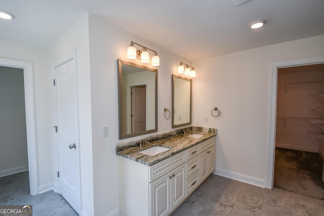 bathroom with dual vanity and tile patterned floors