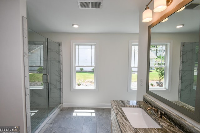 bathroom with vanity and an enclosed shower