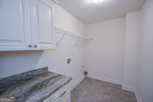 washroom with cabinets and washer hookup