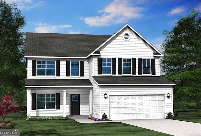 view of front of house with a front yard and a garage