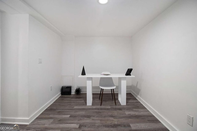 unfurnished office featuring dark hardwood / wood-style floors