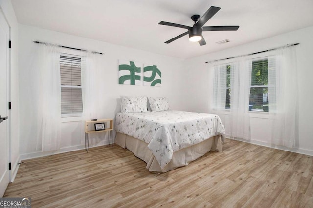 bedroom featuring ceiling fan and light hardwood / wood-style flooring