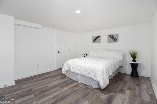 bedroom featuring dark hardwood / wood-style flooring